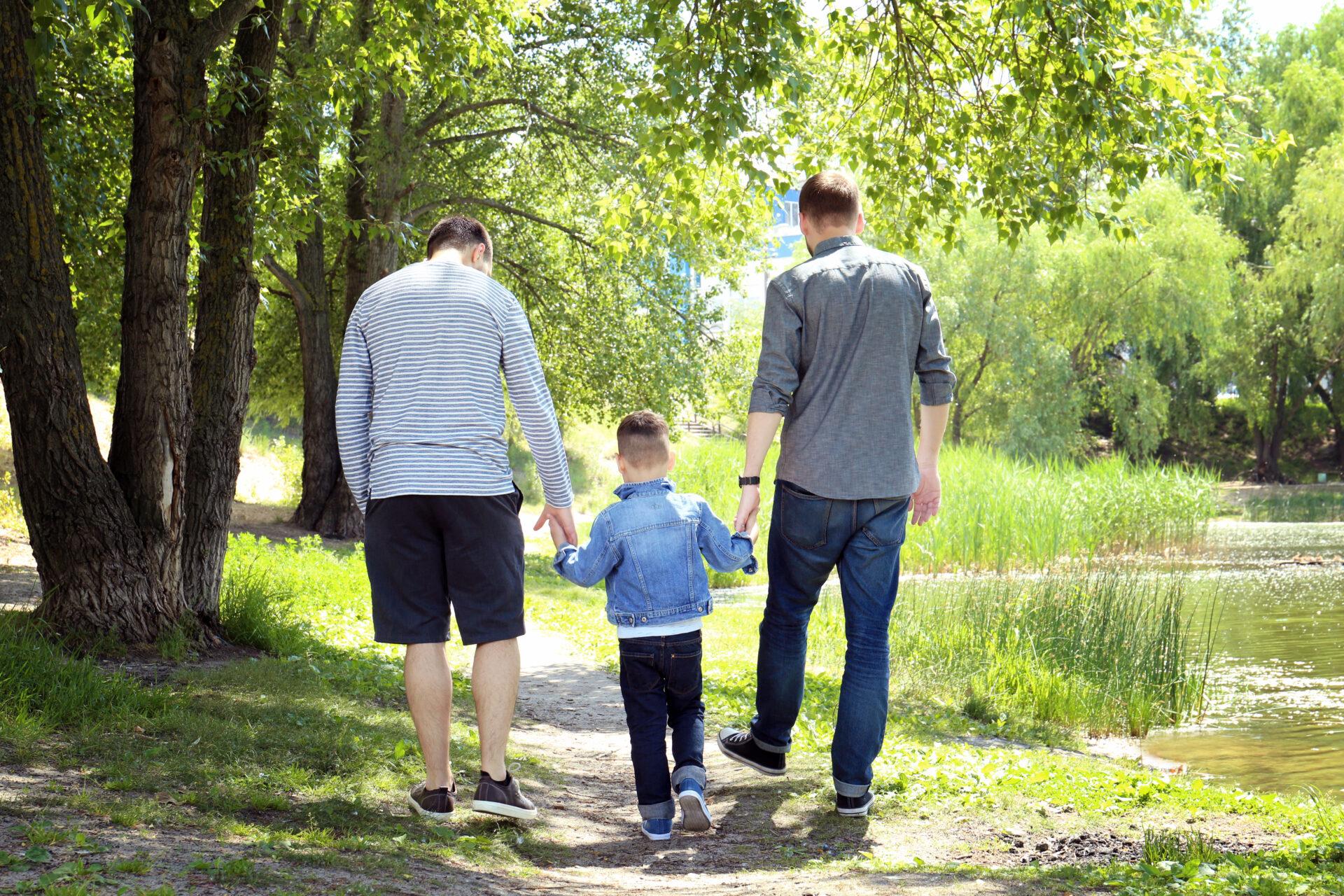 "Side by Side: Navigating OCD Treatment with EFT Couple Counseling" 11 Couple coping effectively with OCD, walking outdoors with their son