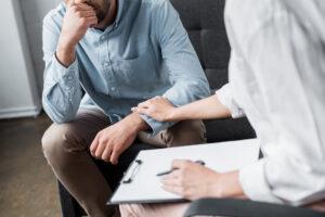Our Therapists 2 comforting reach to a client, from caring professional Reno therapists for relationship counseling
