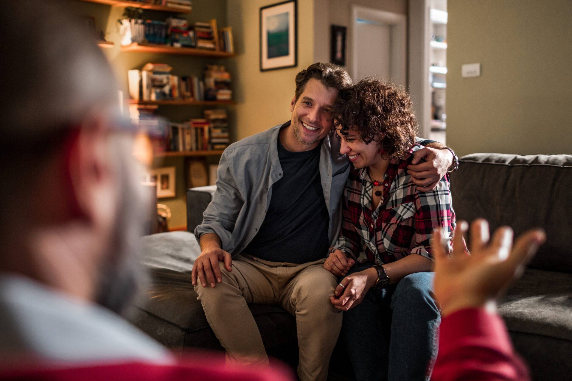 Couple in conversation with a therapist or counselor at home therapy services reno nv with couple.