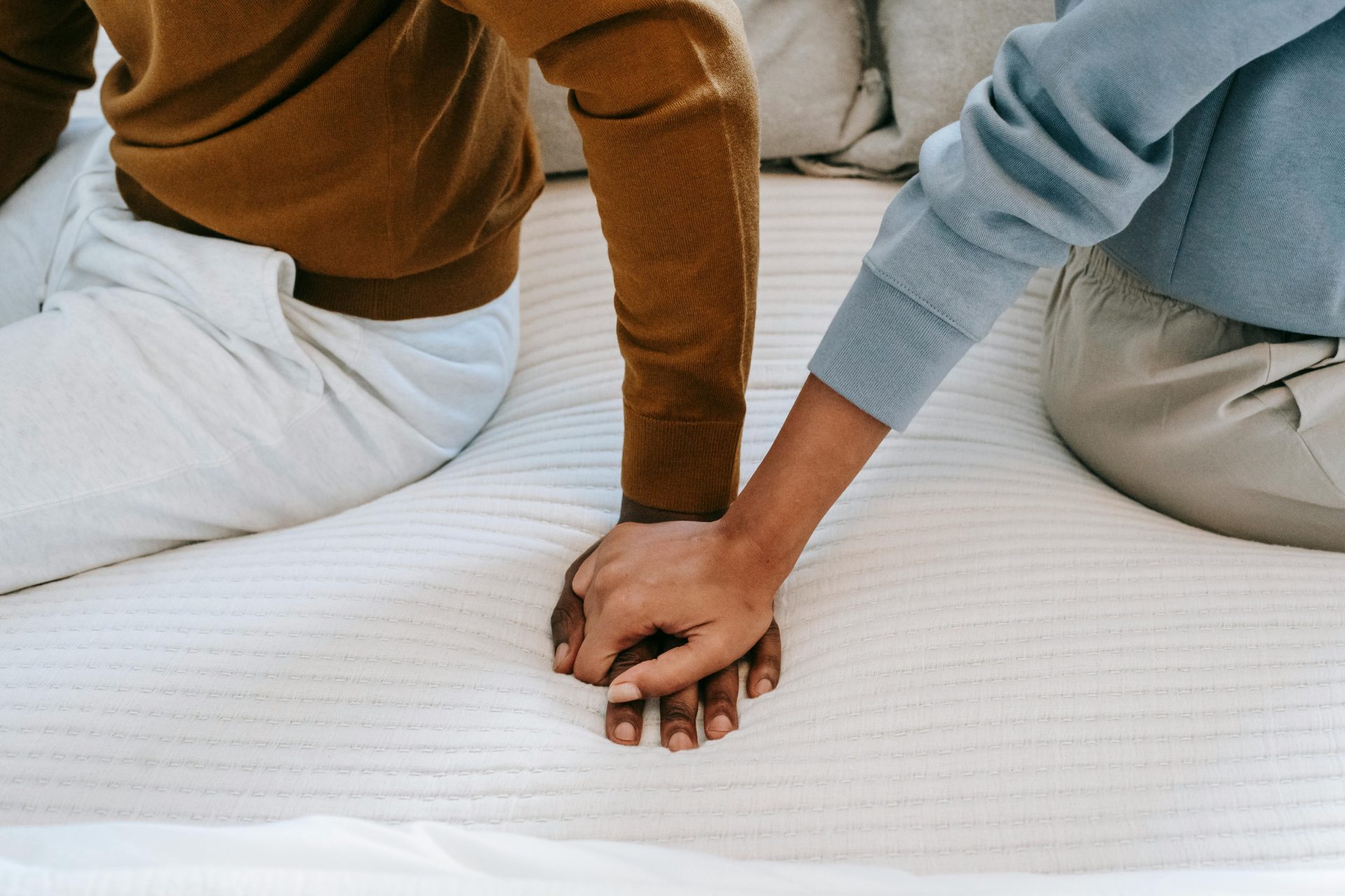 Couple Counseling & Marriage Therapy 8 Couple holding hands during marriage counseling