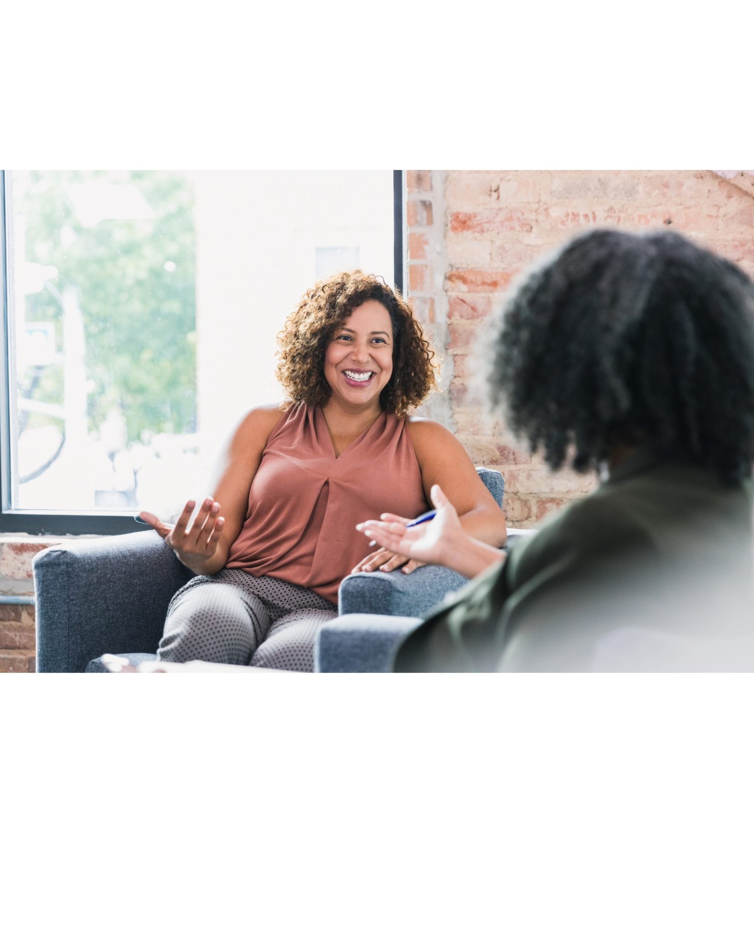 Getting Started 4 Smiling therapist welcoming a client to a session