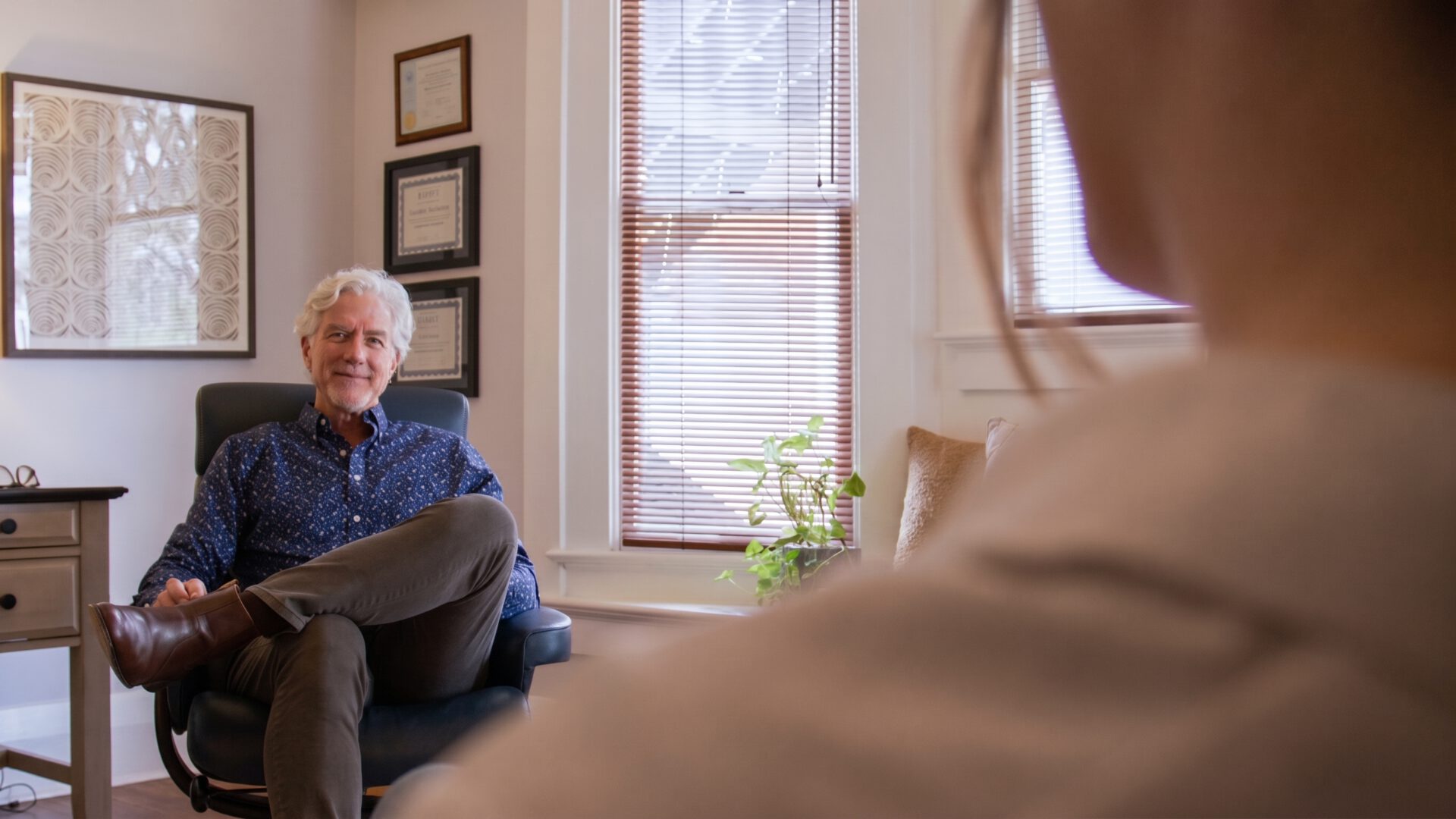 Individual Therapy 1 A therapist listening to a client during an individual therapy session