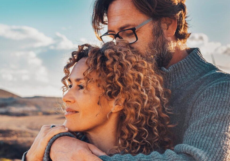 relationship counseling reno, nv with Cornelius Sheehan, LCSW. couple counseling clients embrace, outdoors. Therapy in Reno